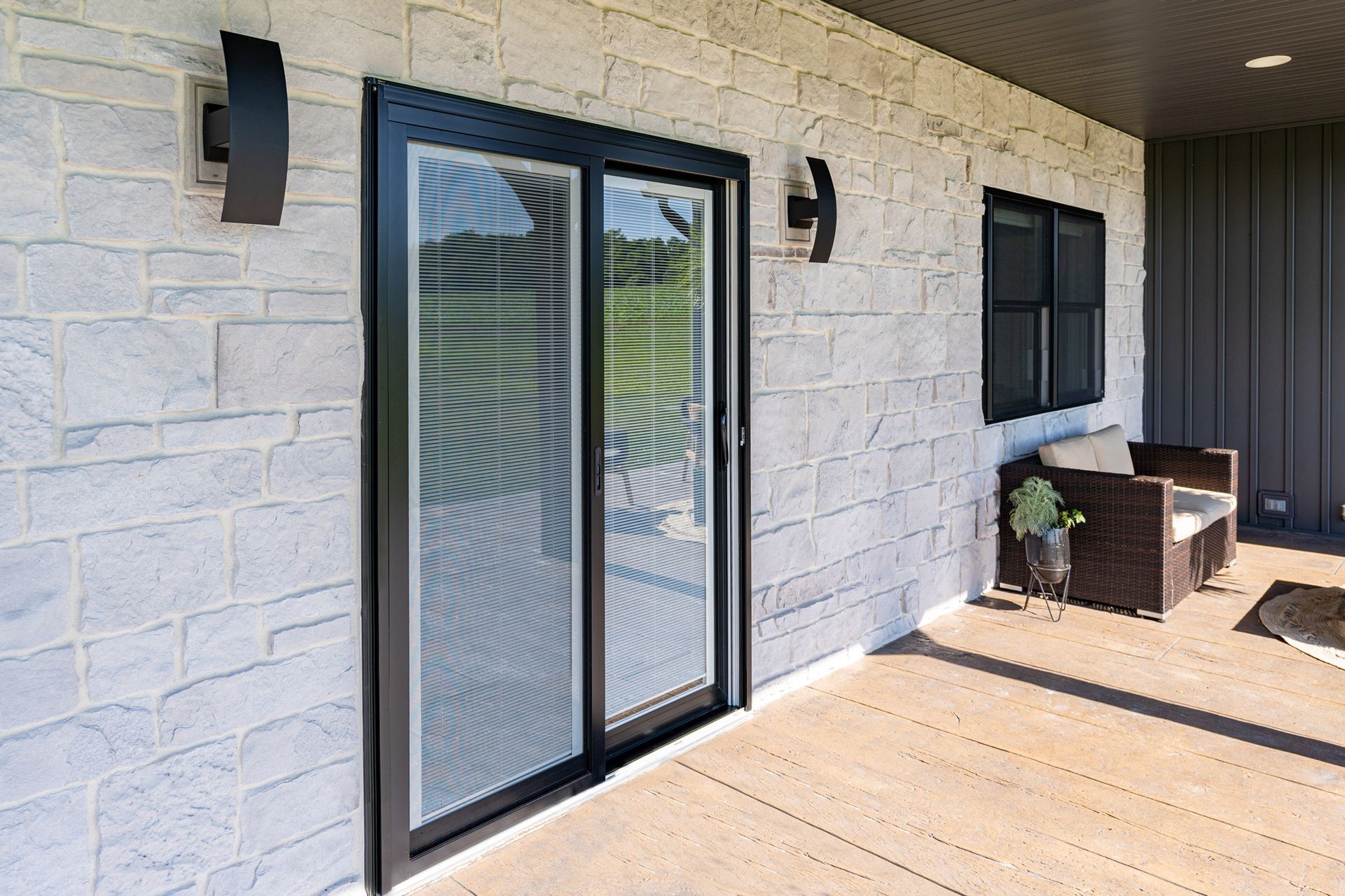 There is a sliding glass door on the side of the house.