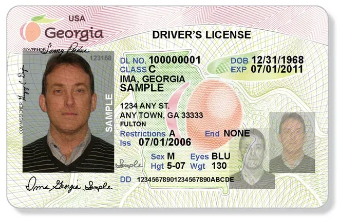 Georgia driver's license with portrait photo and personal details on a pink background