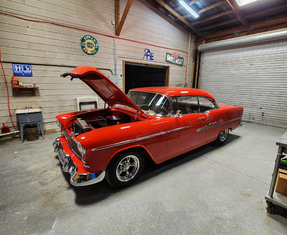 A Bright Red Classic Car With Its Hood Open, Parked on a Gray Floor — Valentine Detailing LLC in Walterboro, SC