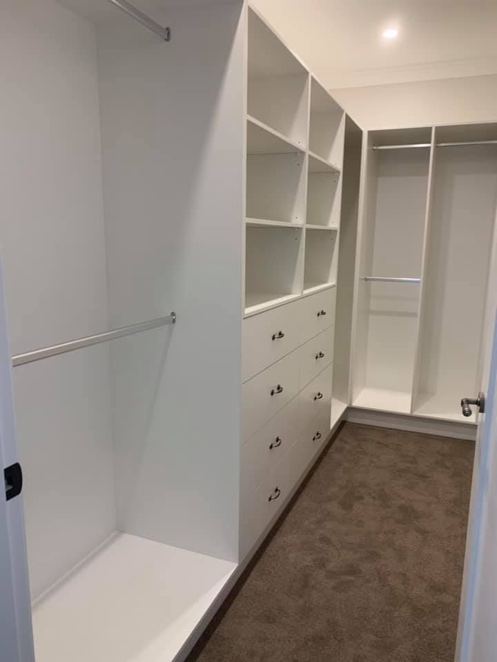 A Walk in Closet with Lots of Shelves and Drawers — GMT Builders Pty Ltd in Moss Vale, NSW