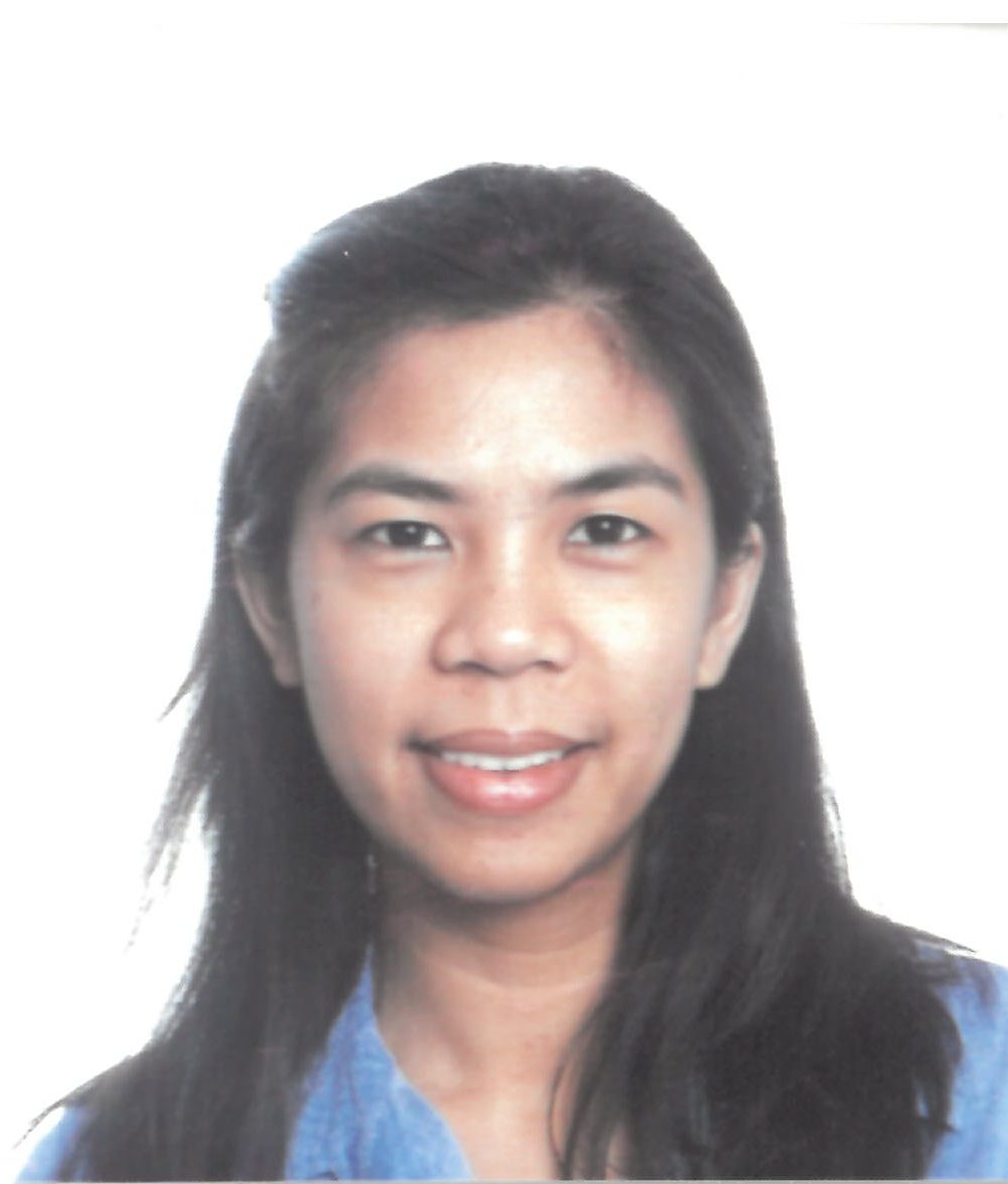 A woman in a blue shirt is smiling for the camera This is Maricel Tanumtanum.