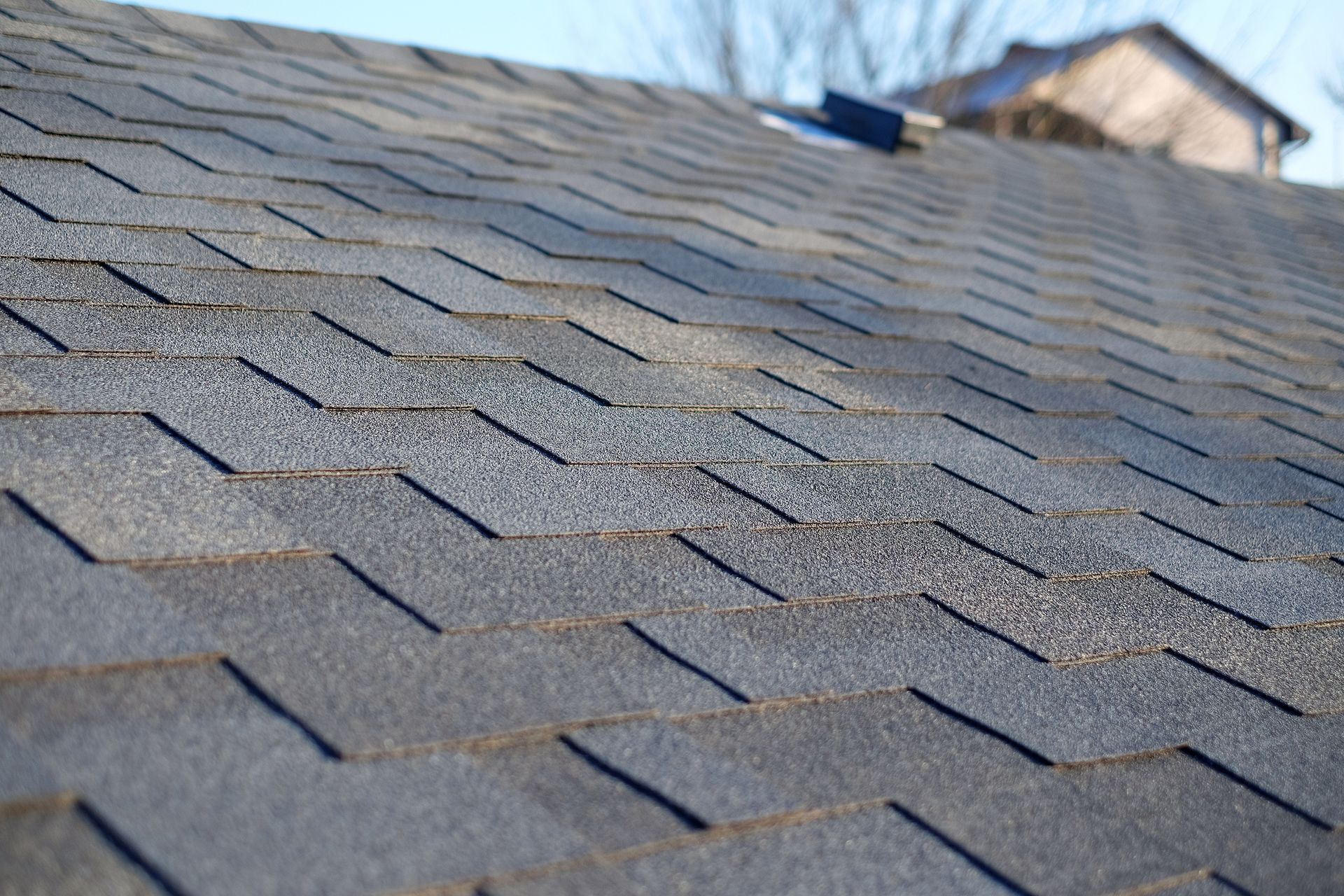 A close up of a roof with shingles on it