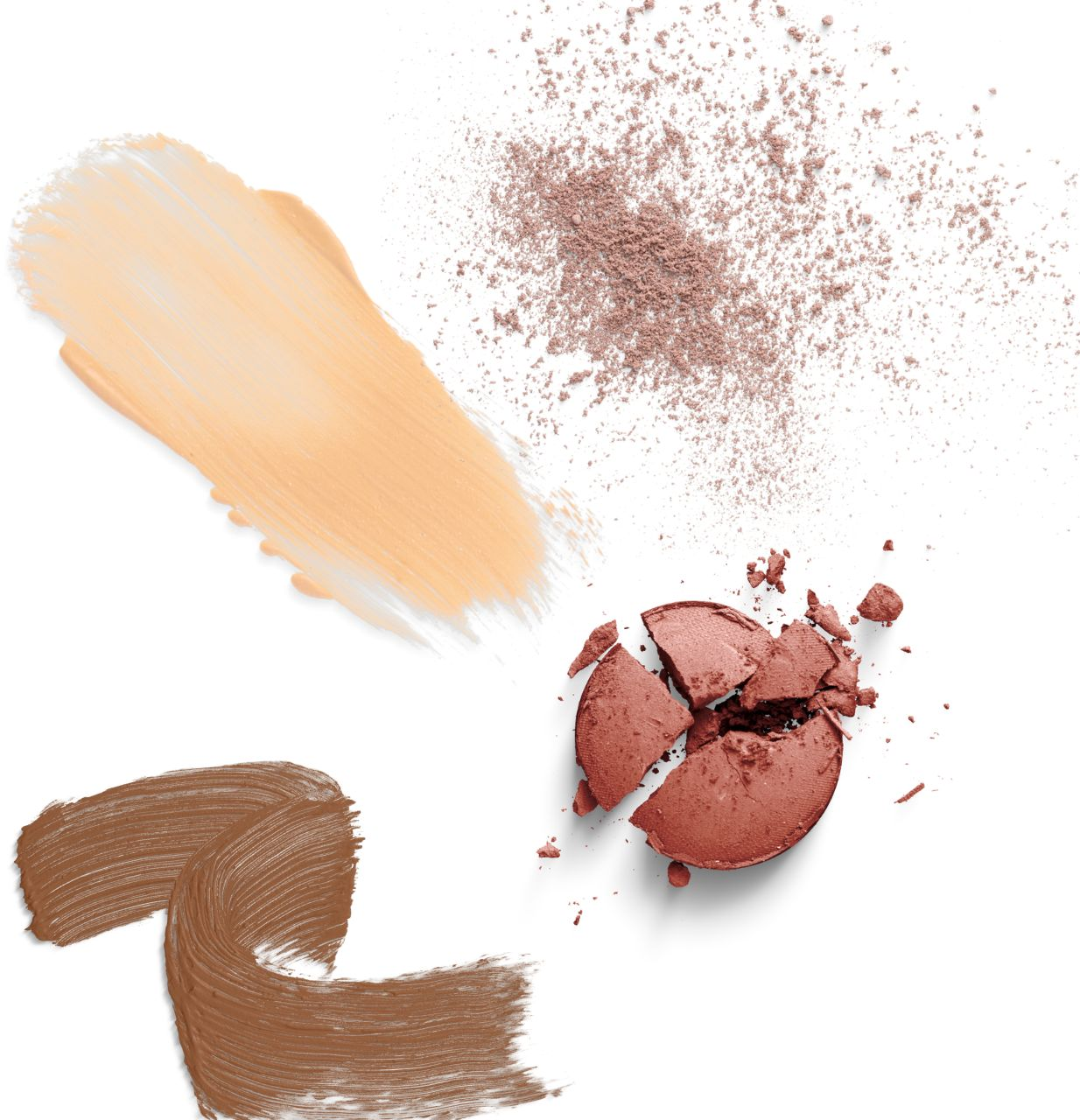 Brush strokes of different shades of makeup on a white background