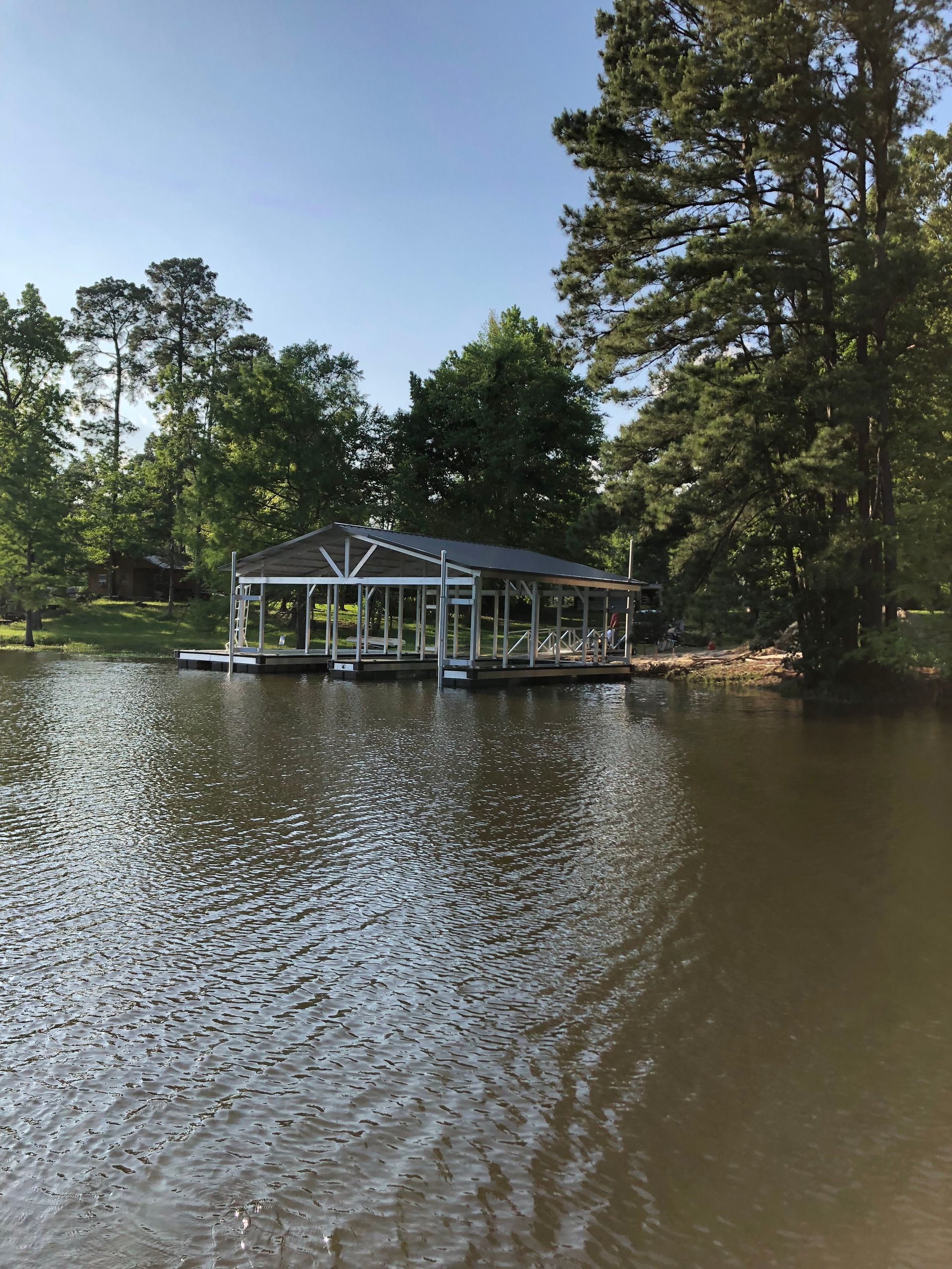Lodge Package gable roof dock featuring Granite Grey Lockdry decking and a Burnished Slate roof - Dock Solutions of Kentucky | Lexington, KY