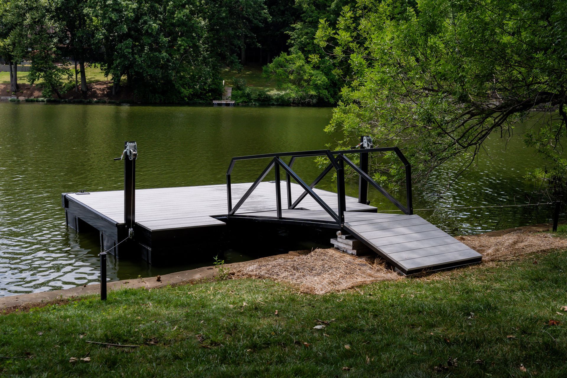 Blue and White boat is at a dock  - Dock Solutions of Kentucky | Lexington, KY