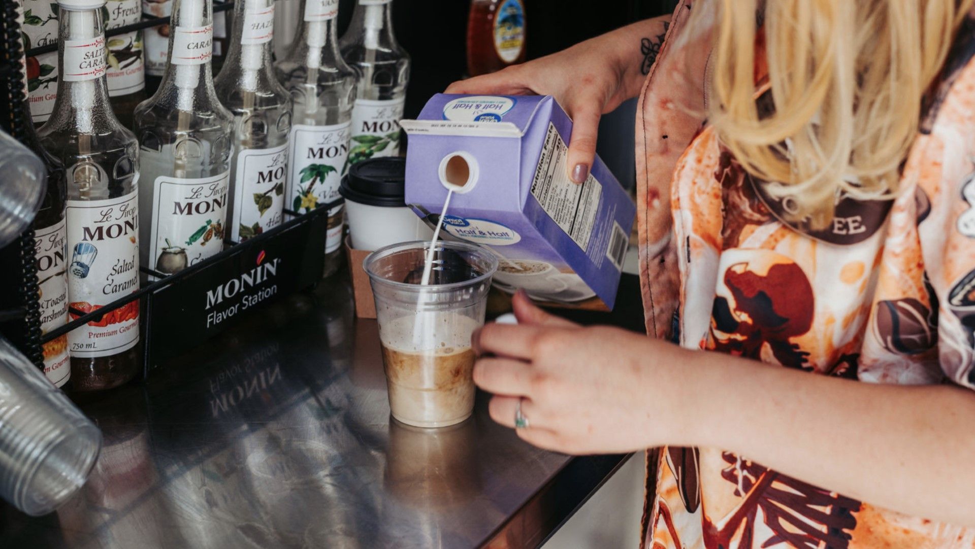 Pouring a mix to a coffee drink - Grindhead Coffee - Chattanooga, TN
