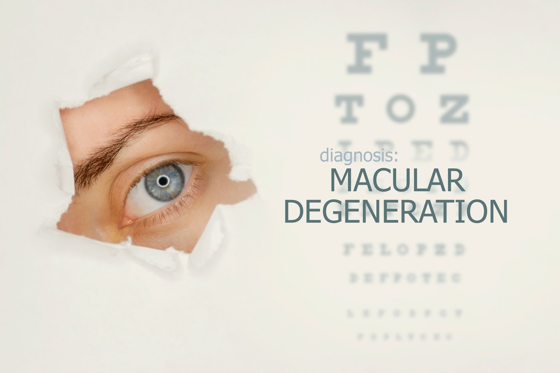 A close up of a person 's eye looking through a hole in a piece of paper.