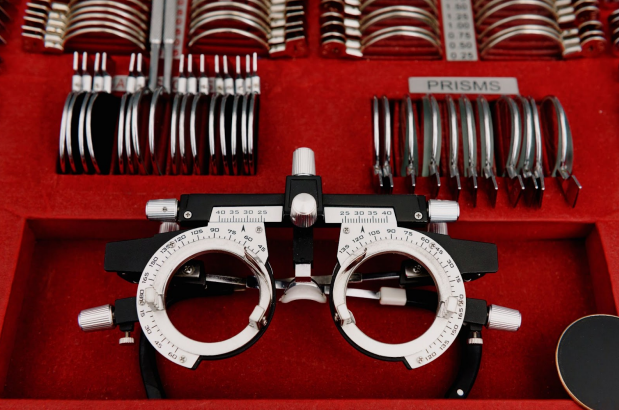 A pair of glasses sitting on top of a red box