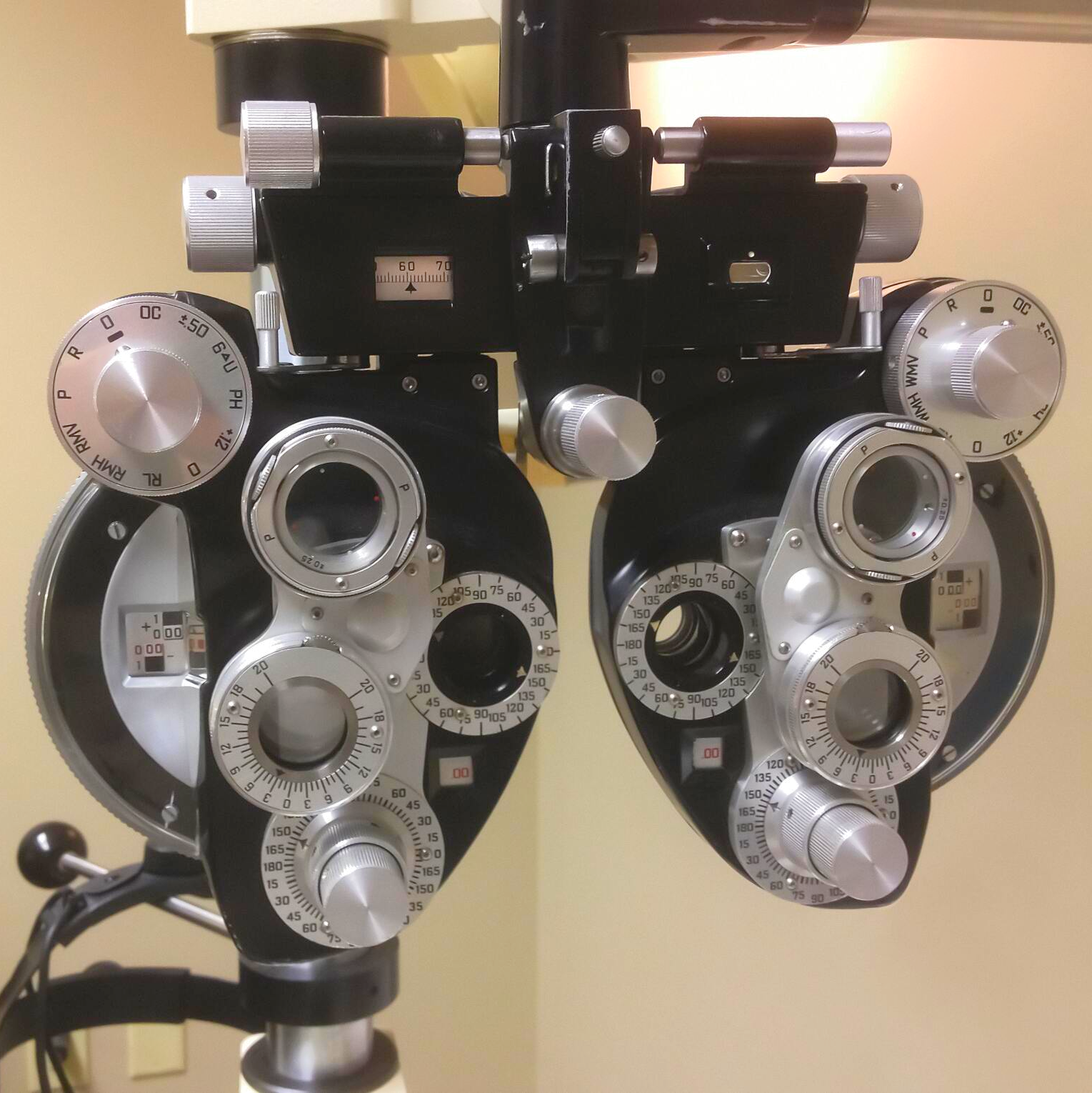 A pair of ophthalmoscopes with numbers 1 through 12 on them