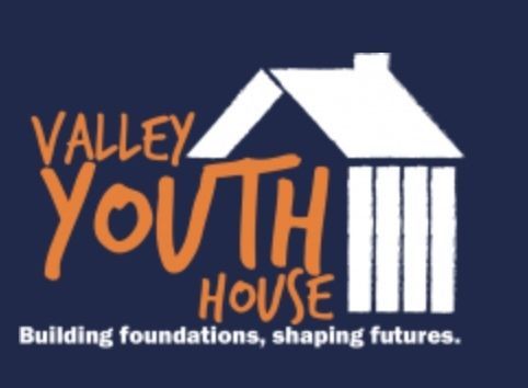 Valley Youth House logo with white house icon on navy background and tagline “Building foundations, shaping futures.”