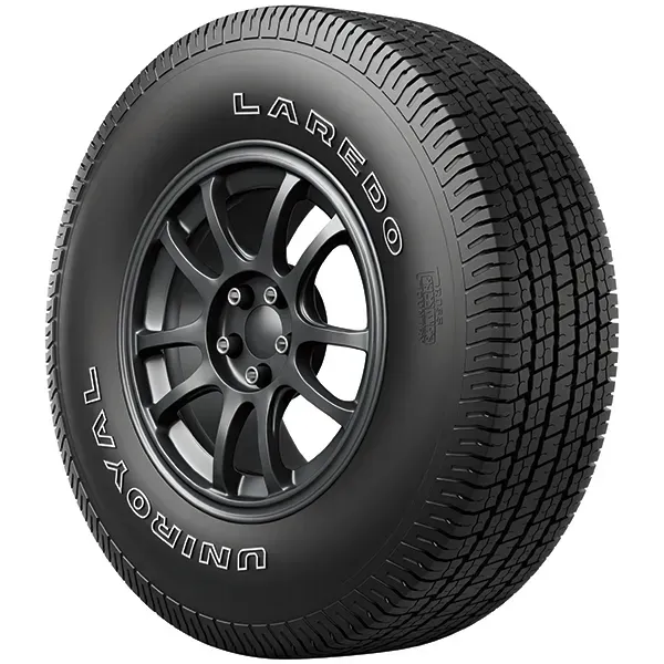 Black Dunlop tire with alloy rim, shown on a white background