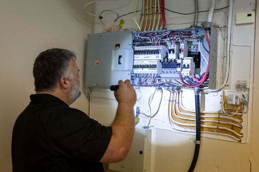 house inspector using a tablet in a living room