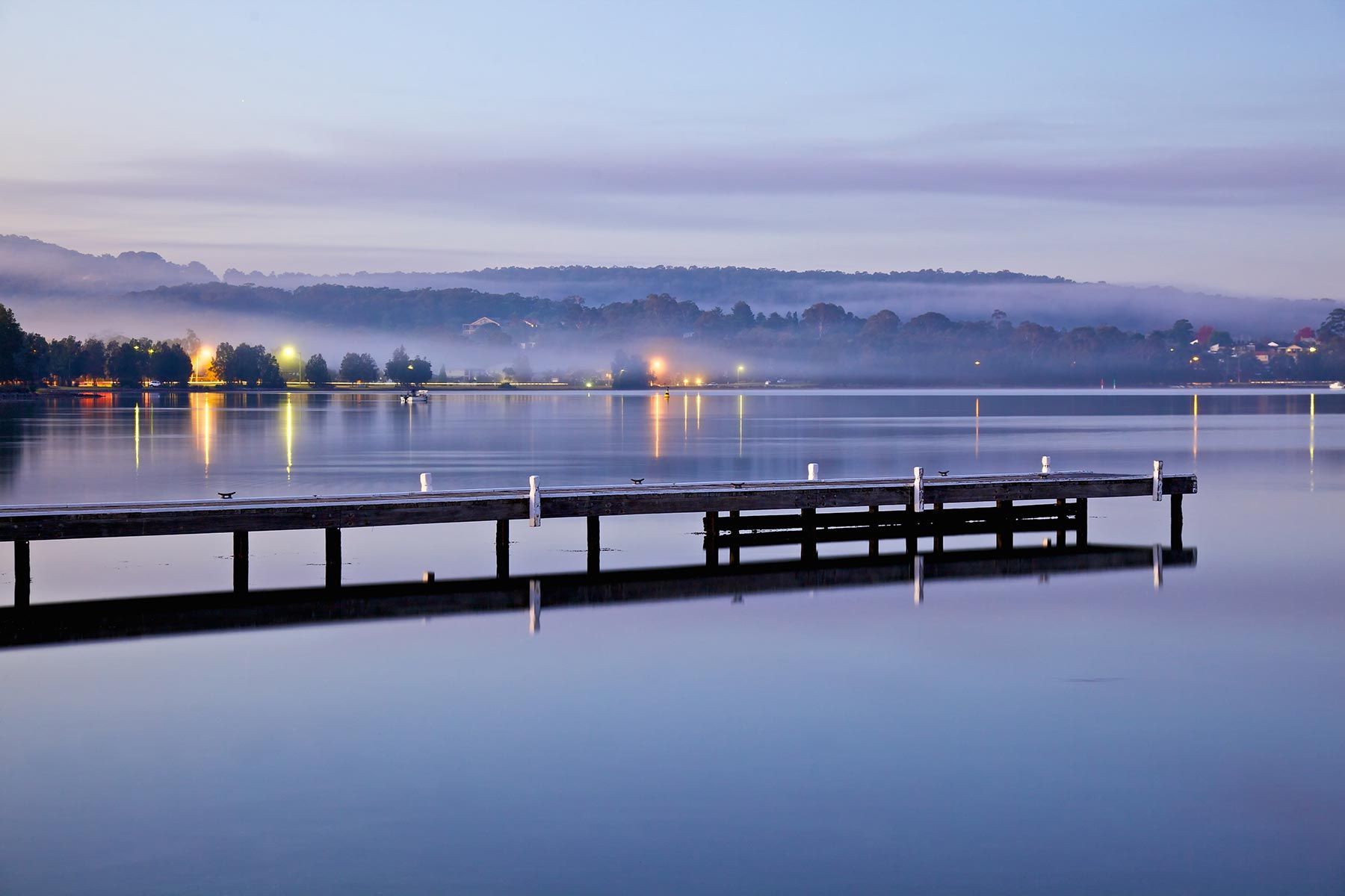 A Dock In The Middle Of A Body Of Water — Tim's Towing and Transport In Warners Bay, NSW