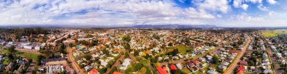 An Aerial View Of A City With Lots Of Houses And Trees — Tim's Towing and Transport In Greta, NSW