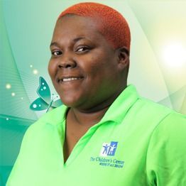 Portrait of a smiling person in a bright green shirt against a teal and white background