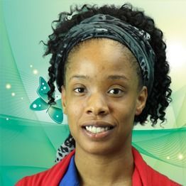 Woman smiling in red blazer against a green abstract background with butterfly graphics