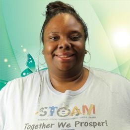Smiling woman in a white T-shirt with “TEAM Together We Prosper!” against a green abstract background