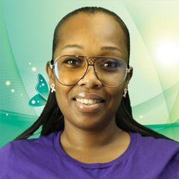 Smiling person in glasses and purple shirt against a green abstract background
