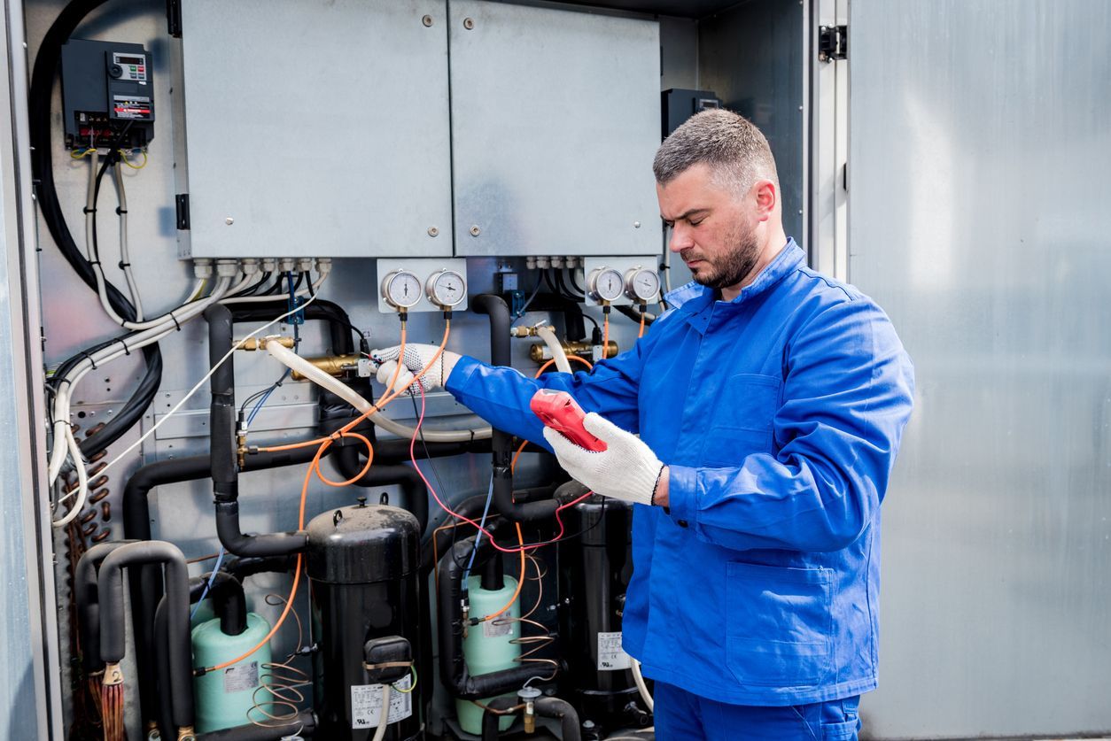 RS Sales & Service technician maintaining large commercial freezer