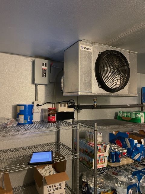 view of cooling fans inside a commercial refrigeration unit