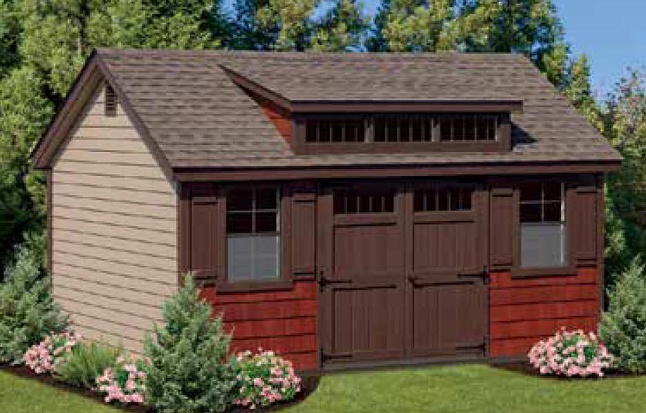 A shed with plants around it a shed with a garage door and shutters is sitting on top of a lush green lawn .