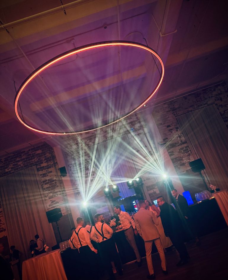 a black and white photo of people dancing at a party