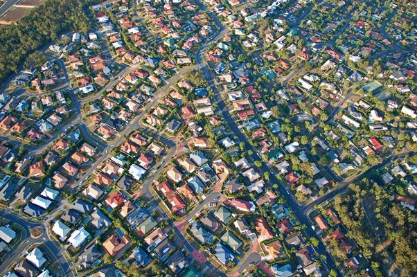 An Aerial View of a Residential Area With Lots of Houses and Trees — A Grade Tree Services in Brisbane, QLD