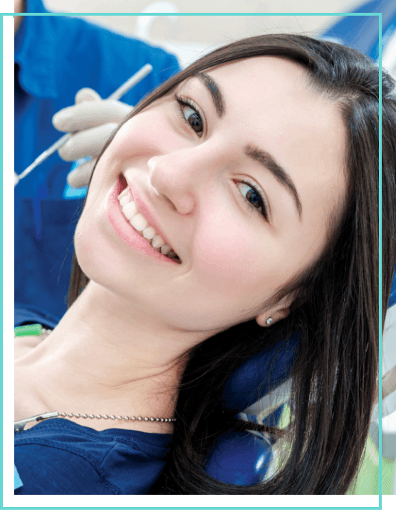 A patient smiling at a dentist office in London, ON