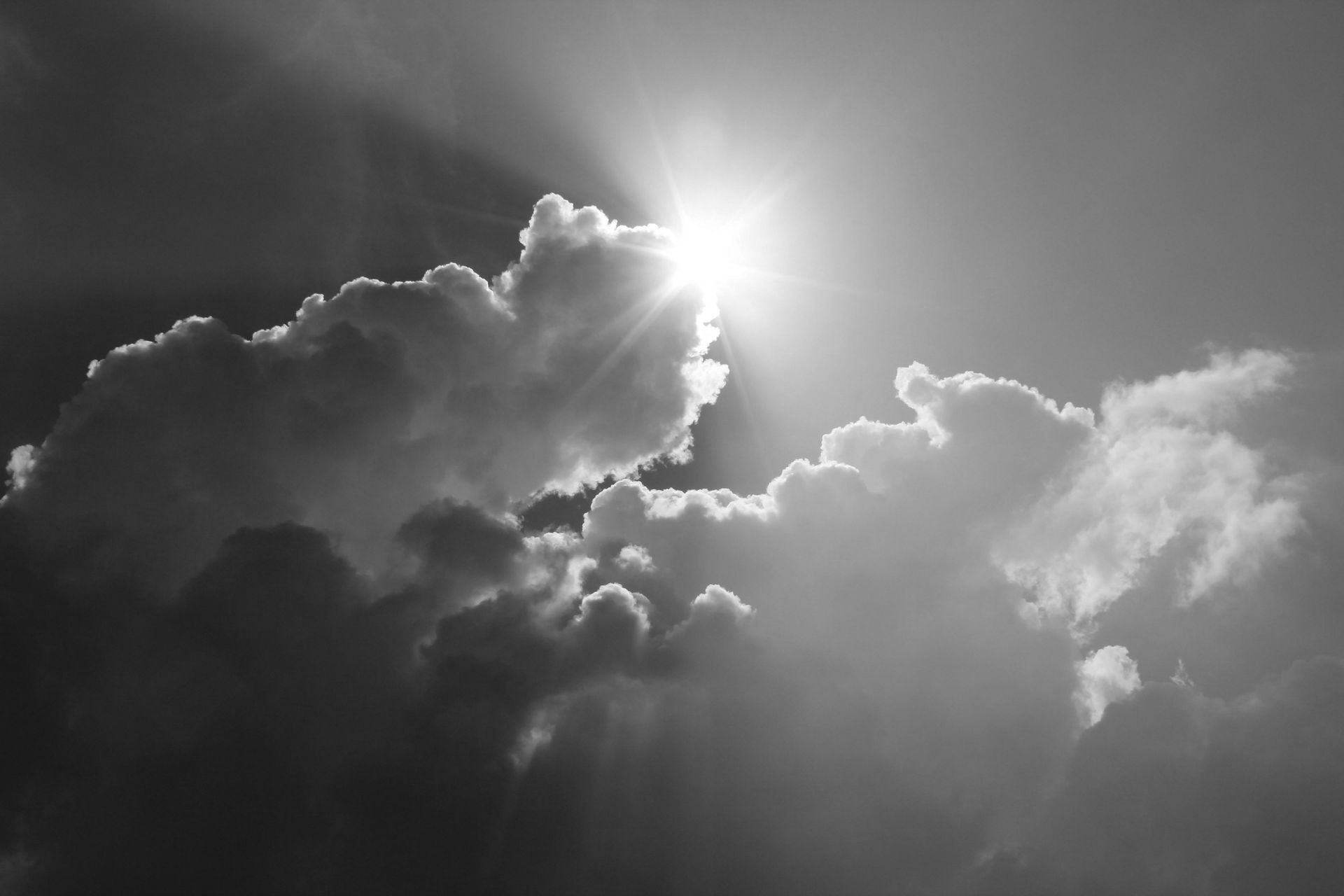 Sun shining brightly through clouds.