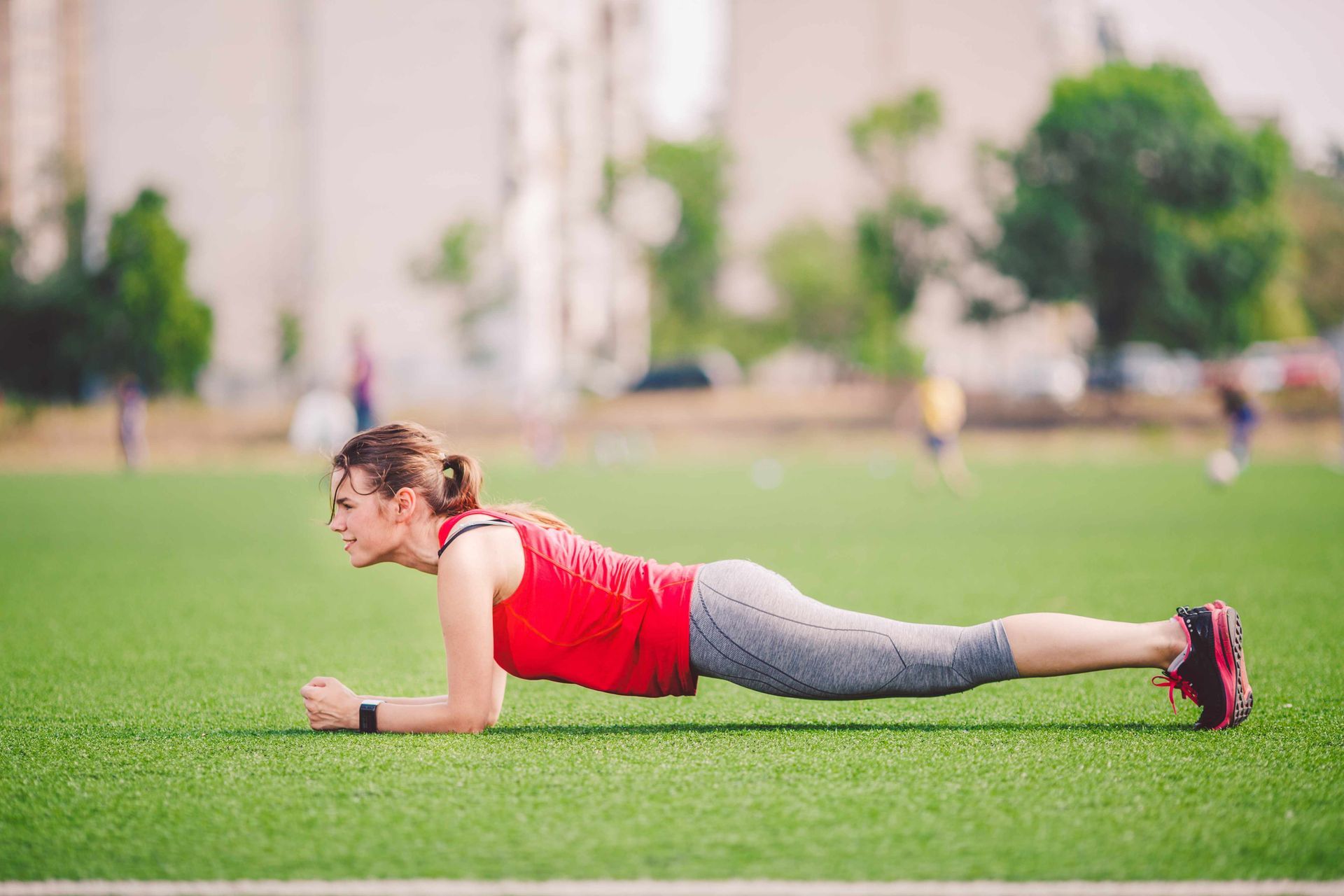 Woman on an artificial turf sports field