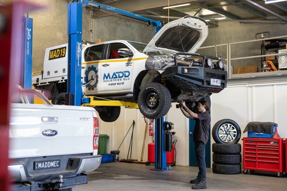 Service Vehicle on the Hoist in Garage — MADD Mechanical in Paget, QLD