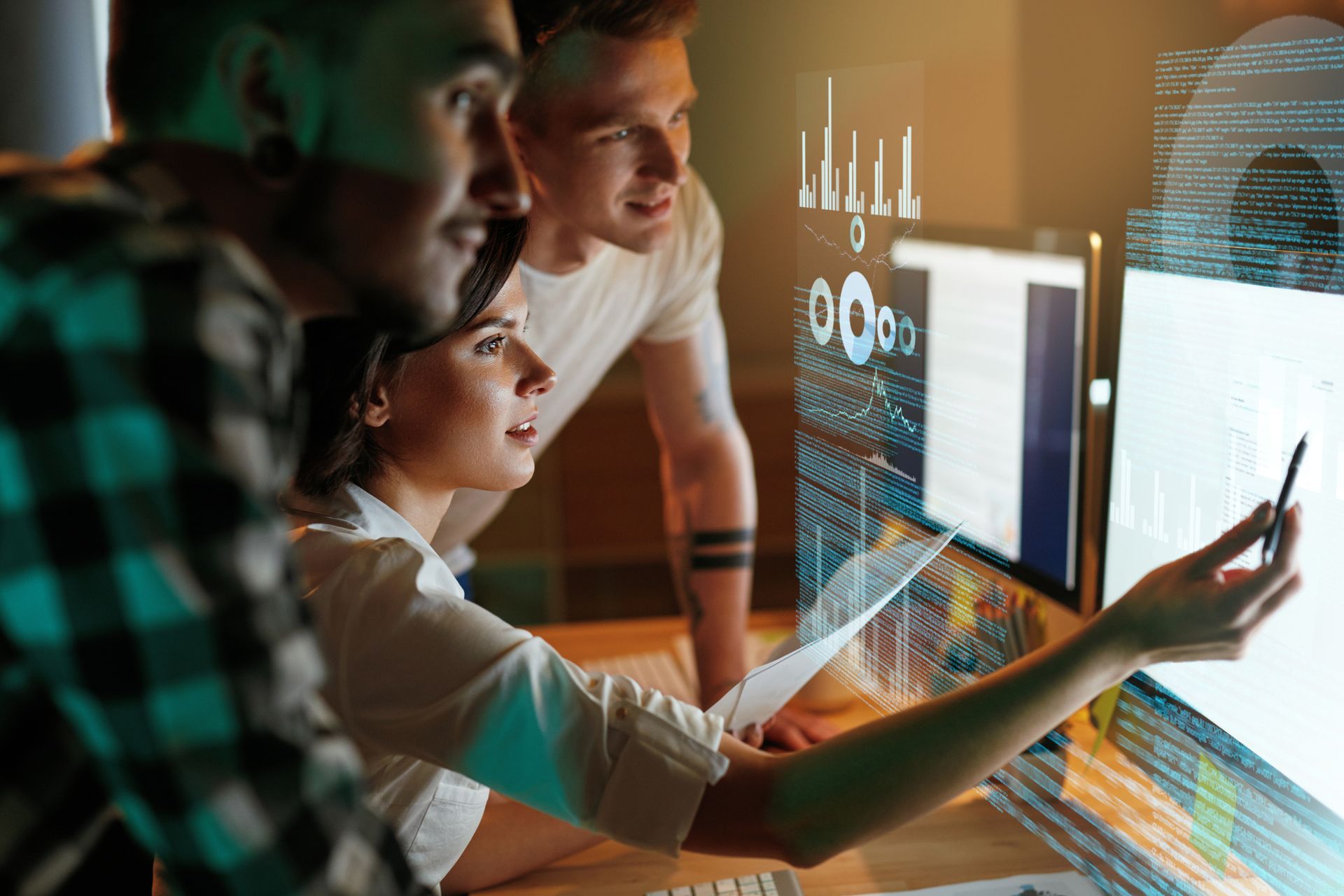 A group of people are looking at a computer screen.