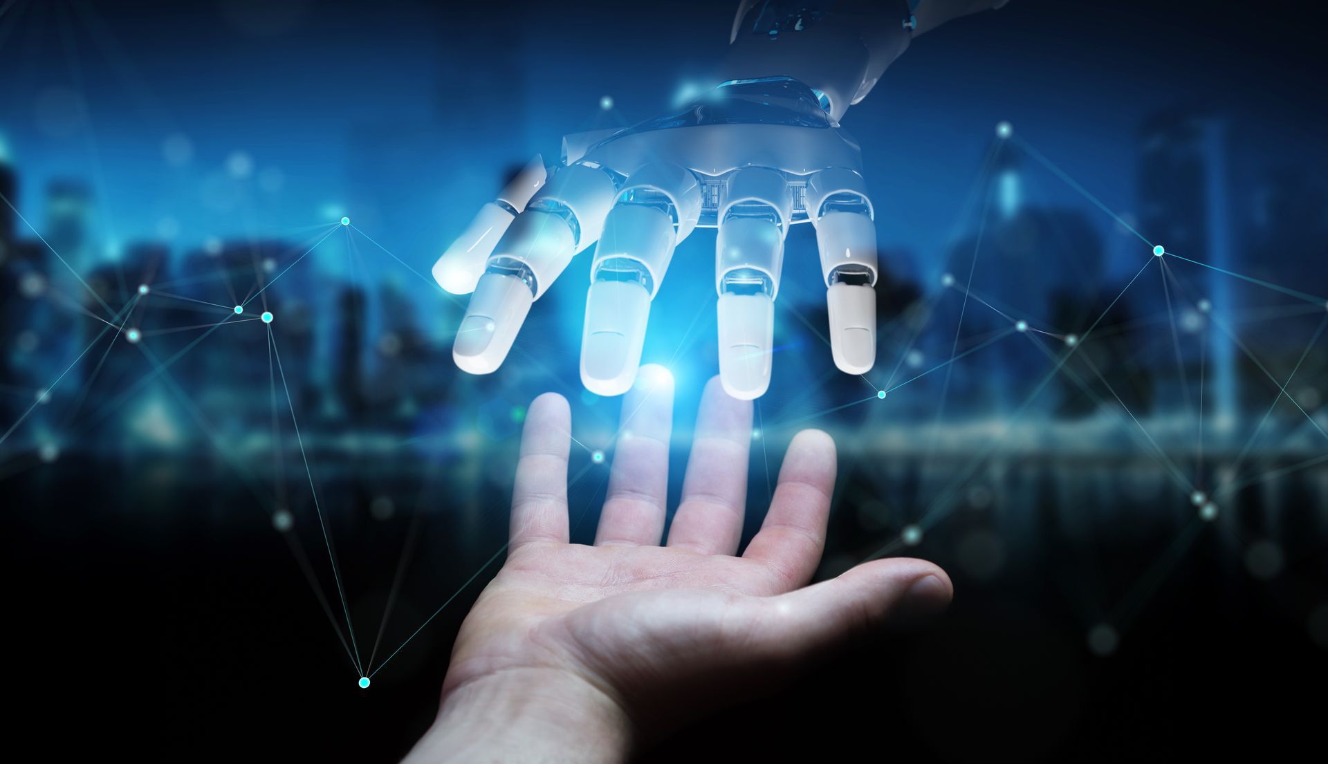 A robotic hand is reaching out to a human hand.