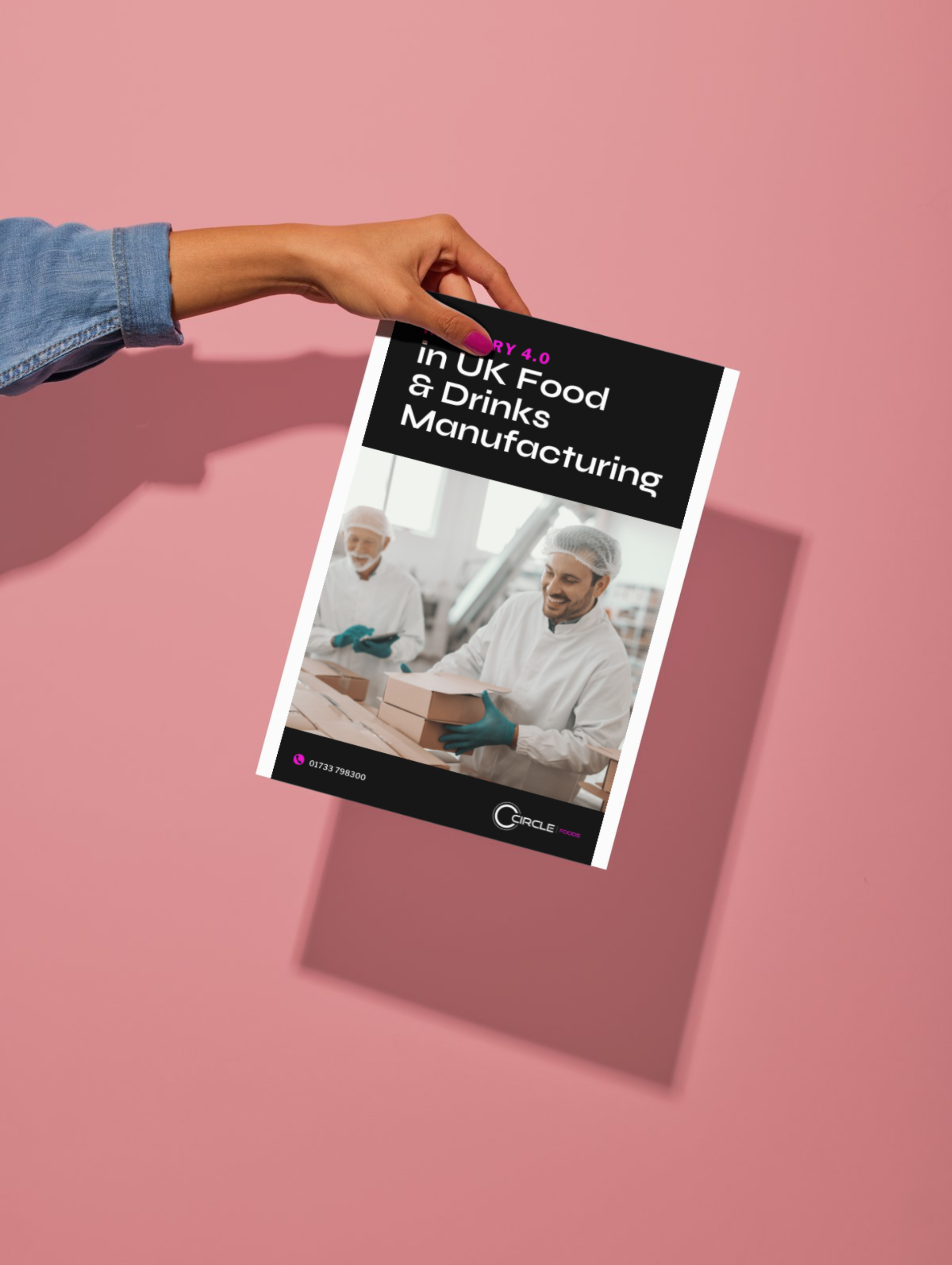 A person is holding a book about food and drinks manufacturing.