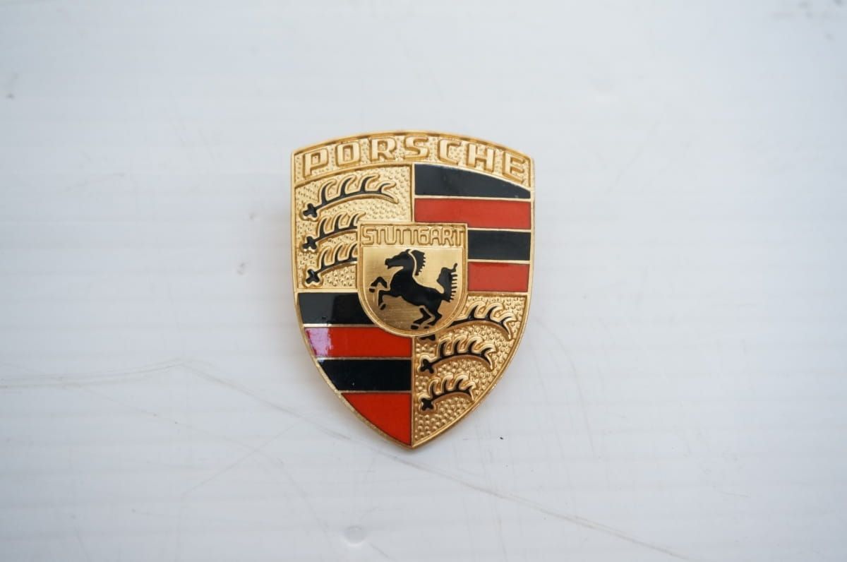 Porsche Embleem op kofferdekselhandvat
