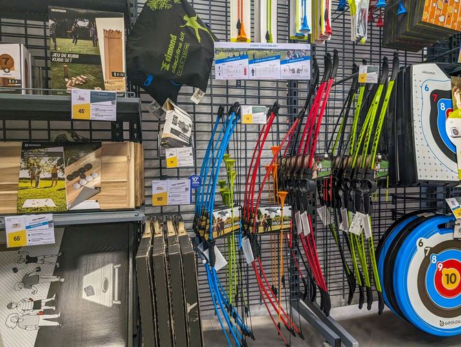 There are many different types of archery equipment on display in this store.