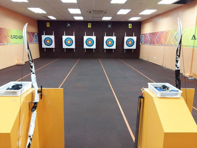 A room with archery targets on the wall