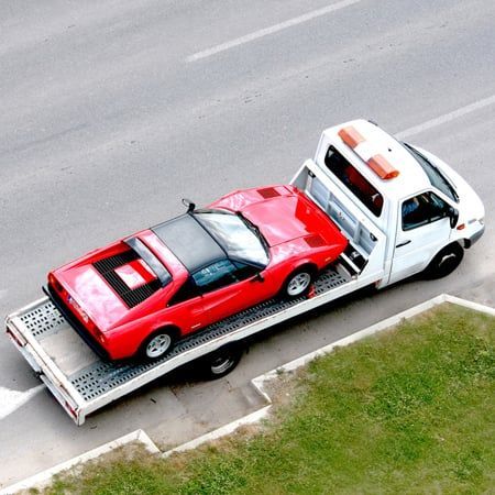 A car being moved by a towing company serving Lima, NY A car being moved by a towing company serving Lima, NY