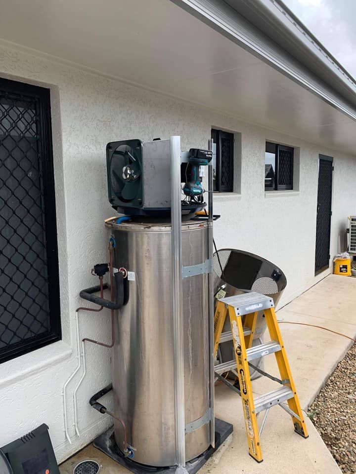 Stainless Steel Water Heater With a Cooling Unit on Top — Vantage Plumbing and Drainage In Coomera, QLD