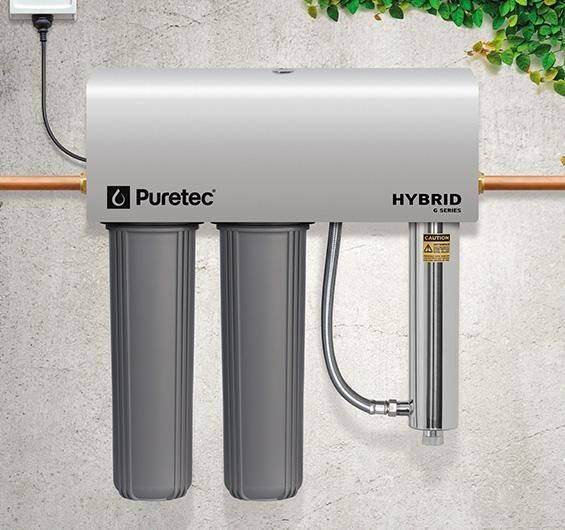 Water Filter System Mounted on a Wall With Filter Housings and Copper Pipes — Vantage Plumbing and Drainage In Nerang, QLD