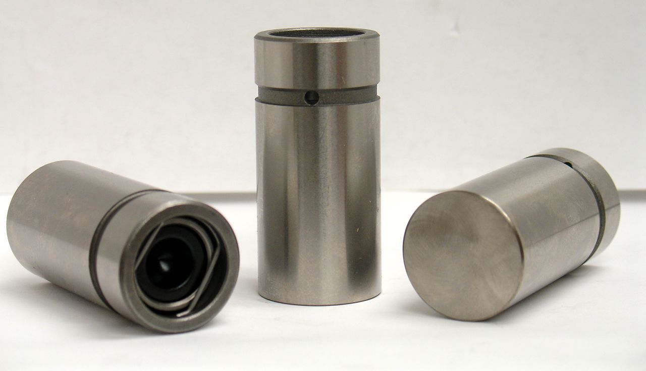 Fuel tank sending unit with a brass float, rubber seal, and retaining ring, used to measure fuel levels.