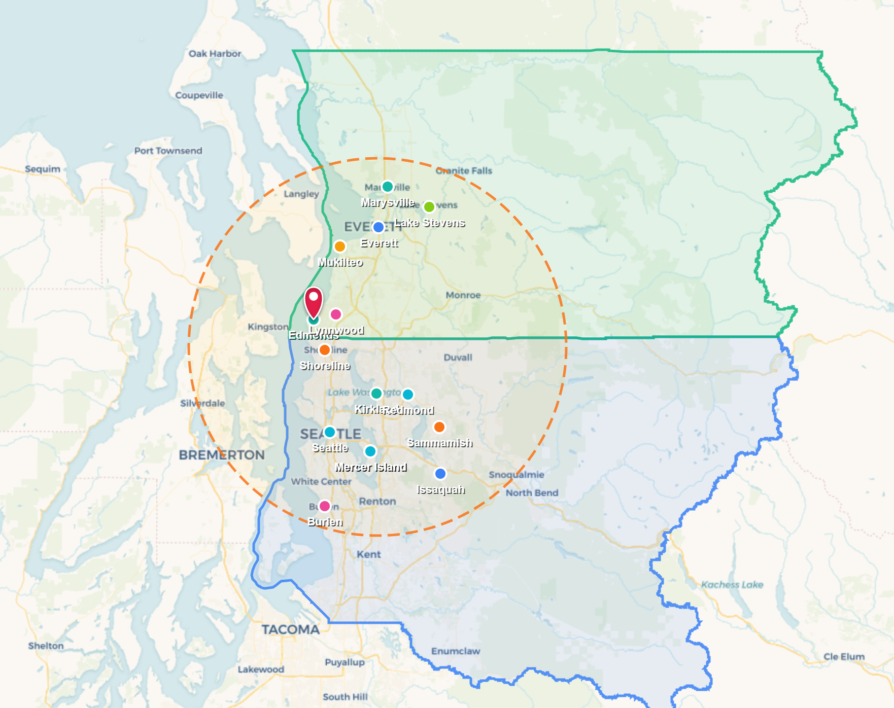 Map showing a red pin, orange dotted radius circle, and green/blue outlined regions over a city map.