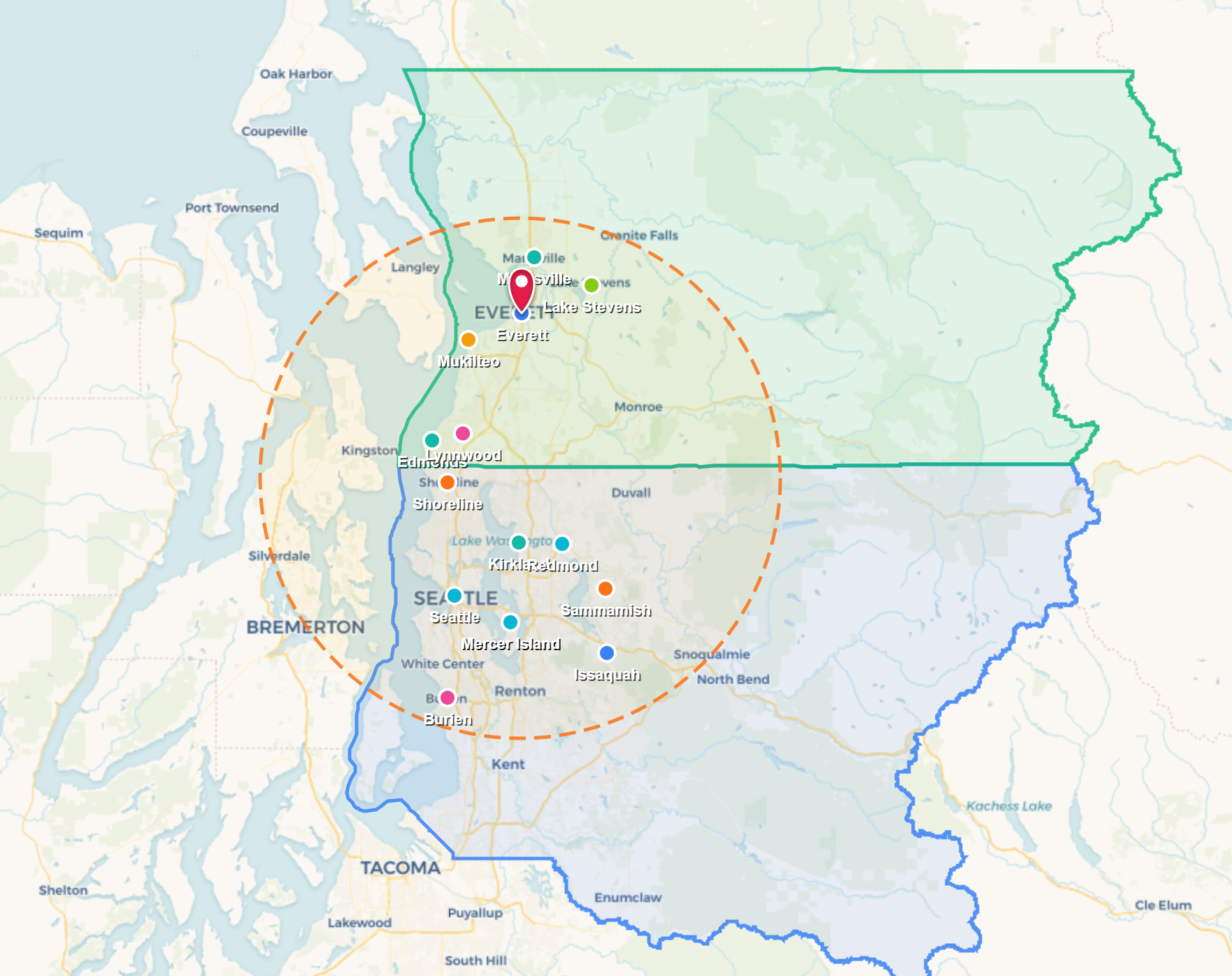 Map with blue and green boundary outlines, orange dashed circle, and multiple location pins.