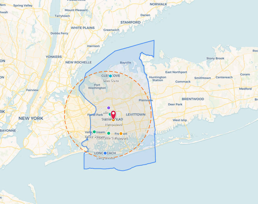 Map with green and blue outlined regions, a red location pin, and a dashed orange radius circle.