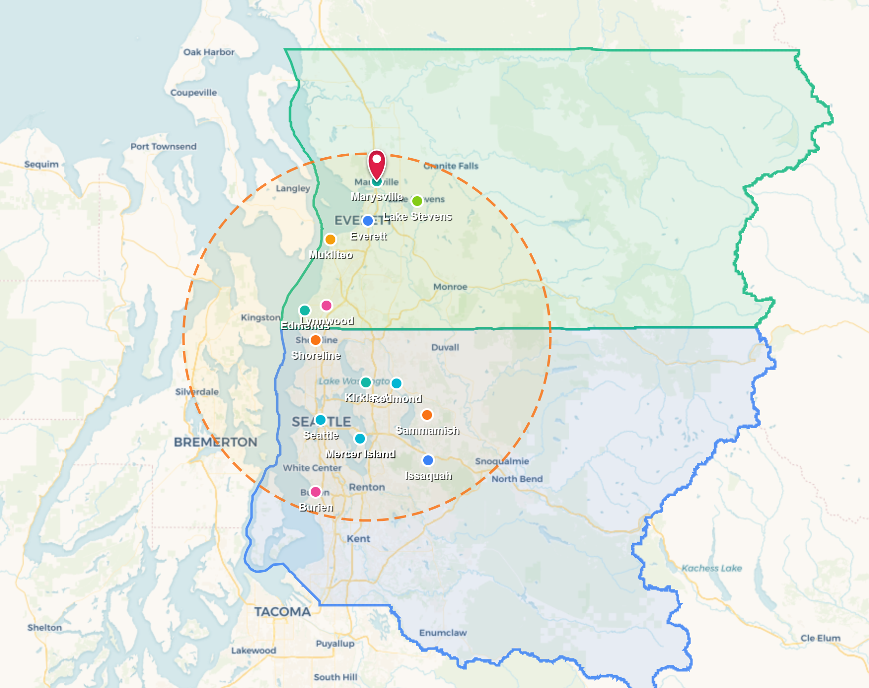 Map with a green and blue boundary, orange dashed circle, and multiple location markers near a city cluster