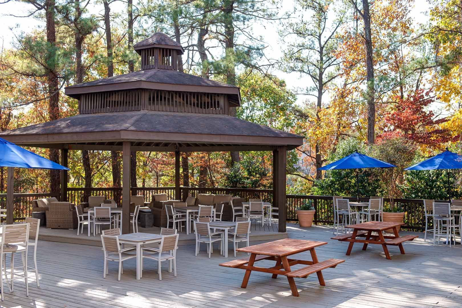 A kitchen with white cabinets, stainless steel appliances, a refrigerator, and a stove.