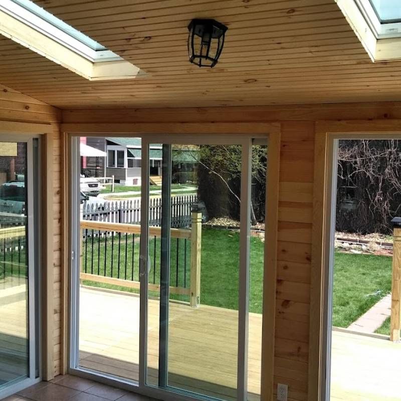A room with sliding glass doors leading to a deck