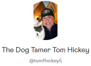 Profile photo of a smiling person in a black hat with a black-and-white dog, labeled “The Dog Tamer Tom Hickey”
