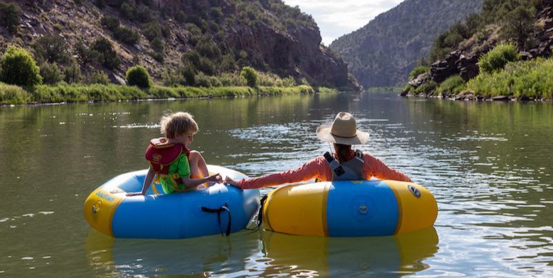 Kids rafting on the river