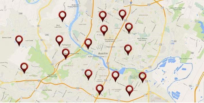 Map with multiple red location pins across a city street map